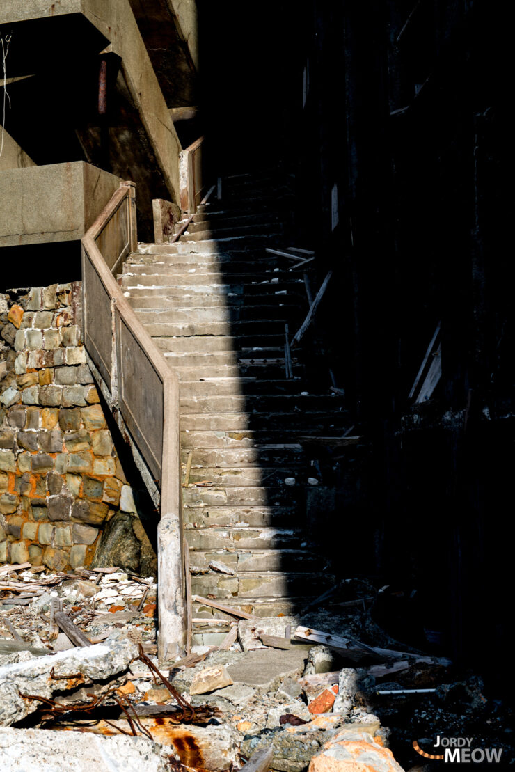 Explore the eerie abandoned staircase on Gunkanjima in Nagasaki, Japan.