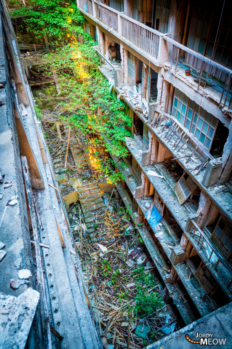 Discover the eerie urban ruins of Gunkanjima, a haunting abandoned island in Japan.