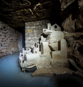 Discover the hidden depths of Parisian catacombs with ancient tunnels and skeletal structures.