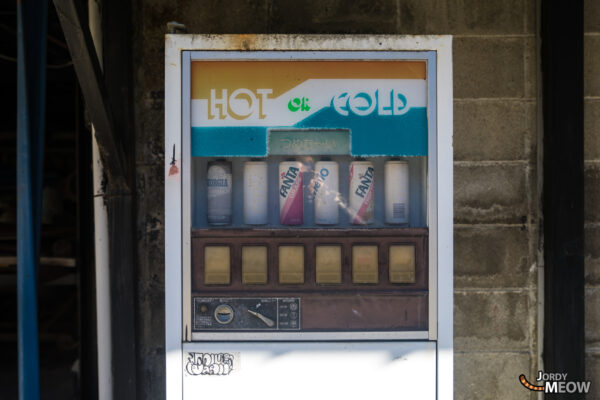 Forgotten vending machine in Japan, symbol of urban decay and consumer culture.