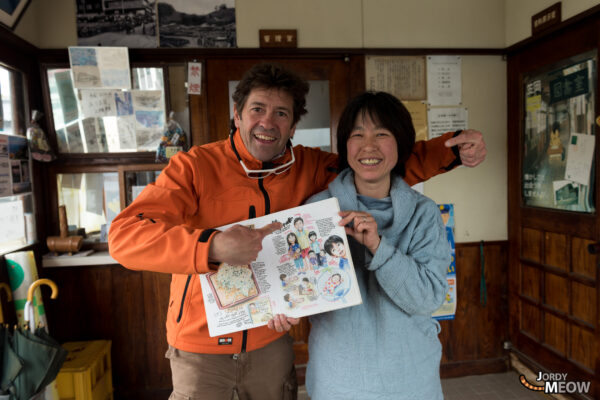 Explore the charm of Manabe-shima, Japan through locals proudly displaying a book by Florent Chavouet.