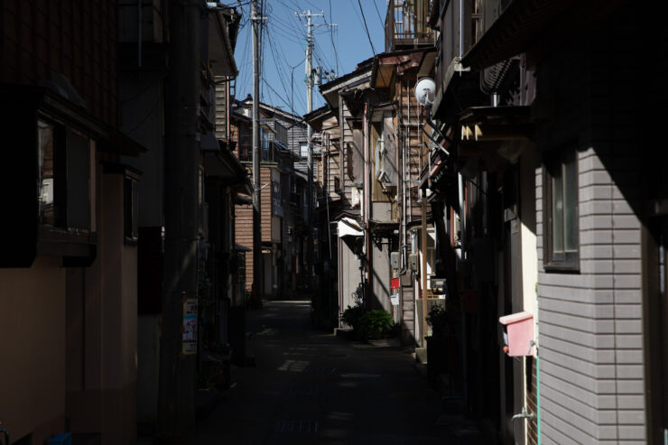 Tranquil historic Japanese village alleyway, traditional architecture.