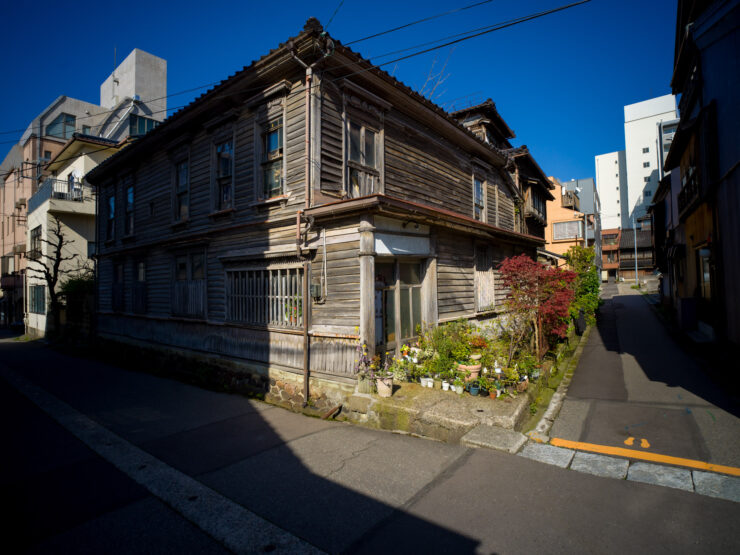 Old Japanese wooden house urban contrast.
