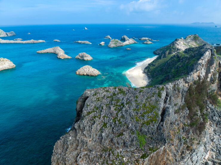 Serene Turquoise Seascape with Rocky Cliffs